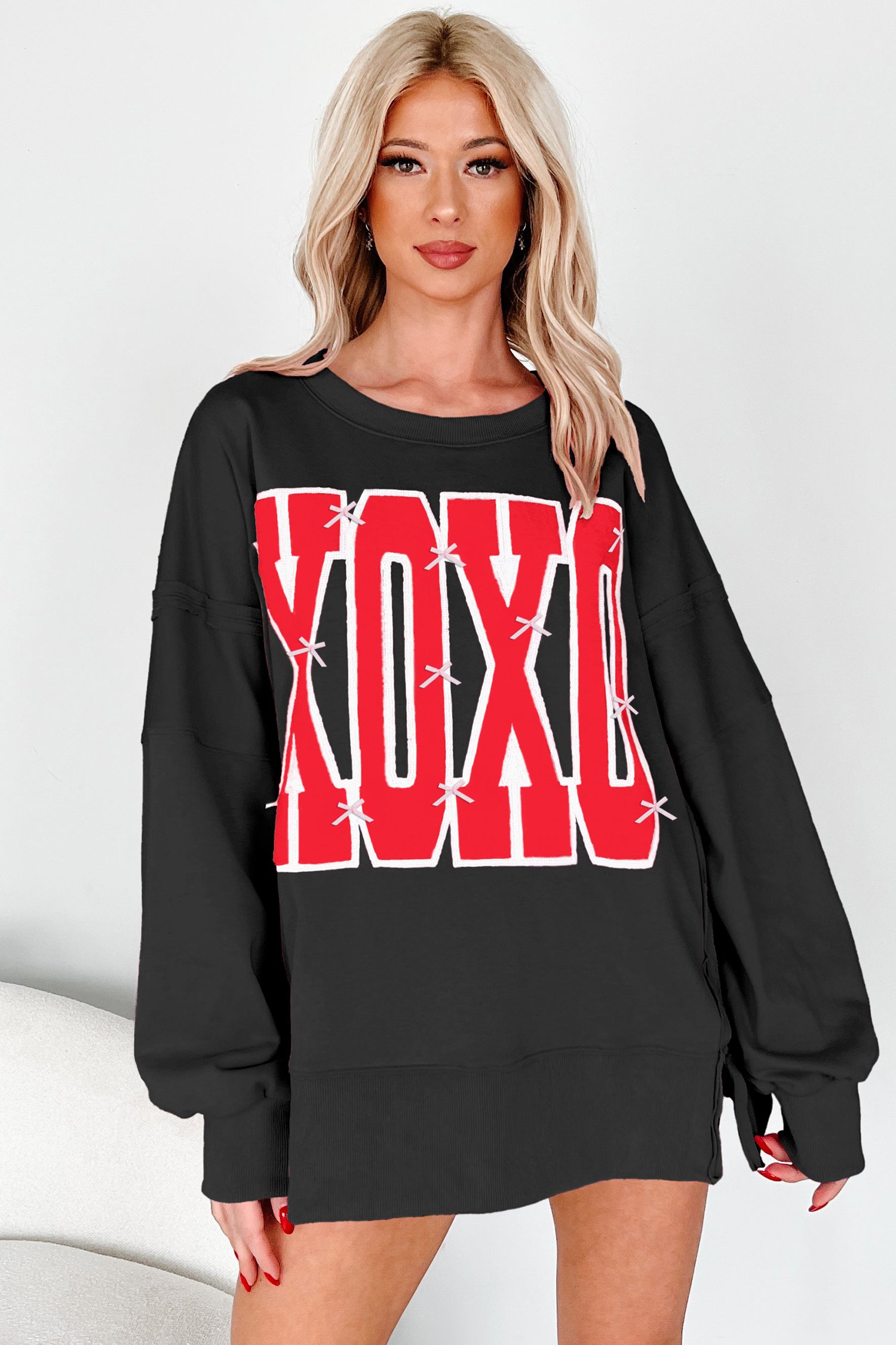 96054401-20e4986b97d39f70.jpg black bow sequin xoxo letter graphic exposed seam baggy sweatshirt