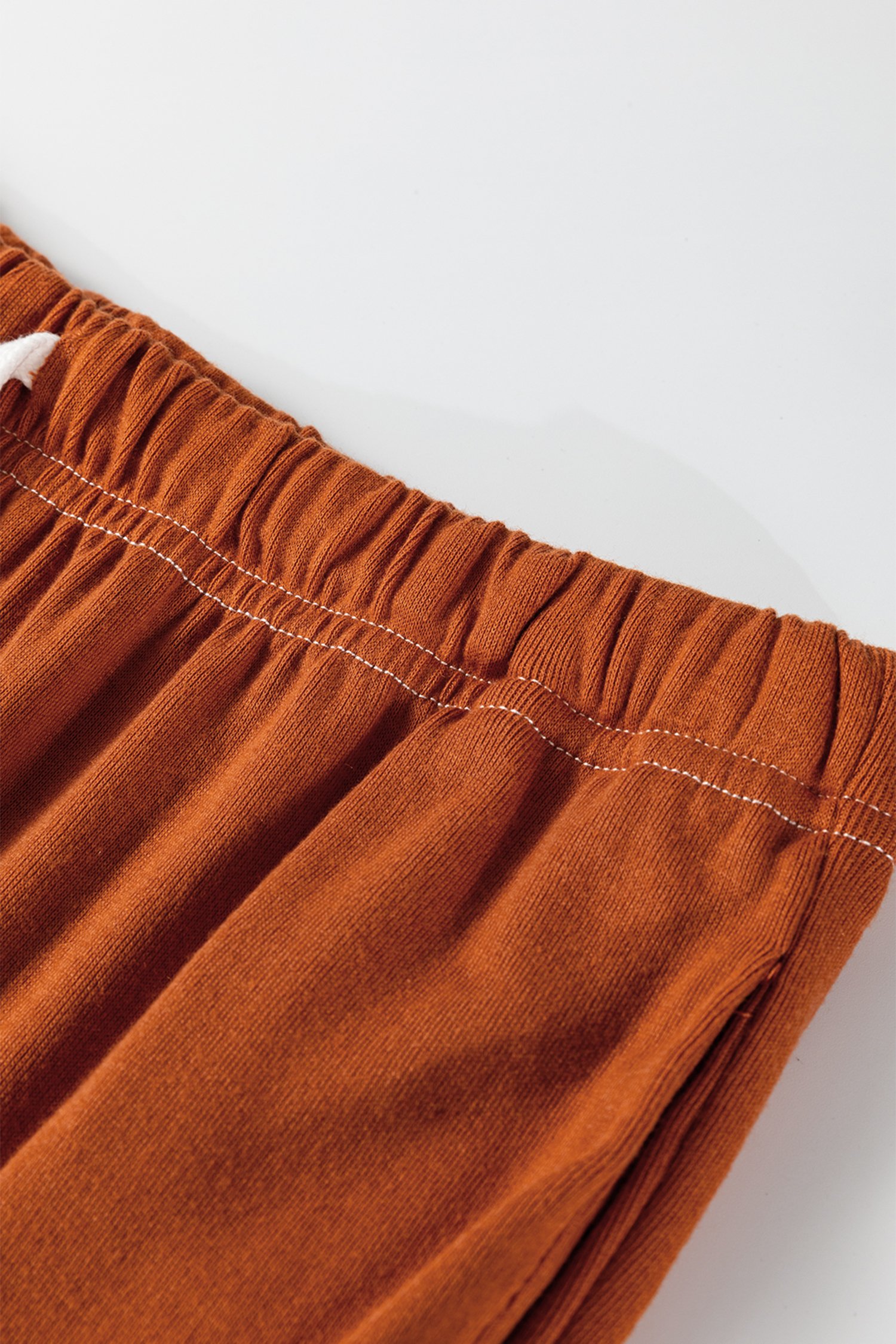 96861942-a40e4b50d6c14cb3.jpg grapefruit orange contrast stitching buttoned v neck half sleeve top and drawstring flare pants set